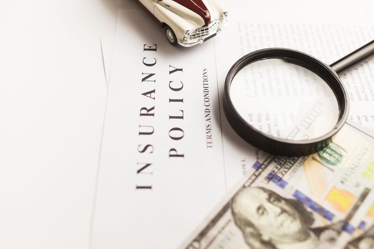 Comparing car insurance quotes from multiple providers on a laptop screen